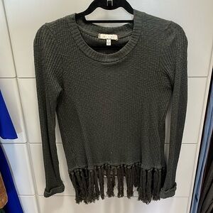 Green sweater with tassels and fun back!